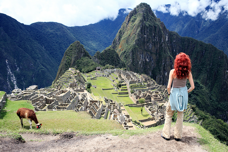 A woman stood at Machu Picchu, Peru