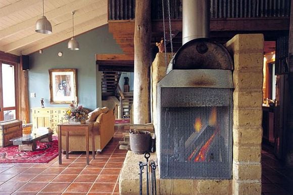 Keep warm by the fire at the Old Leura Dairy