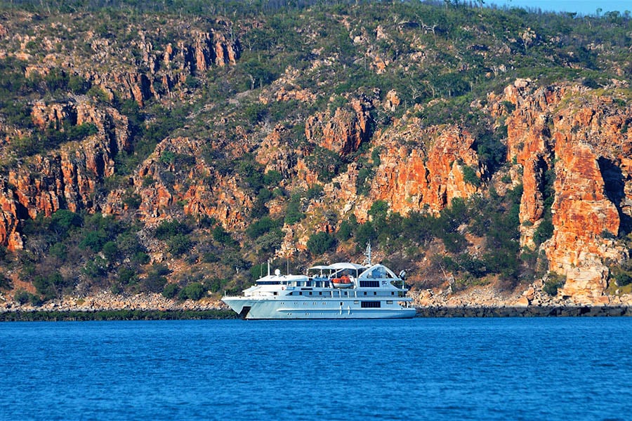 Cruise next to the red cliffs of the Kimberley | Photo credit: Coral Expeditions