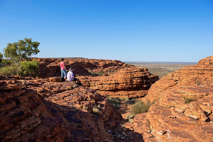 Couple sat on rim of Kings Creek | Northern Territory, Australia