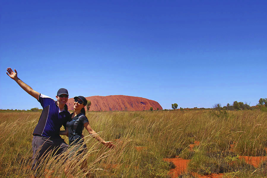 Couple taking Uluru selfie 