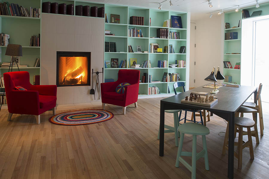 Spend cosy evenings by the fire | Credit Fogo Island Inn