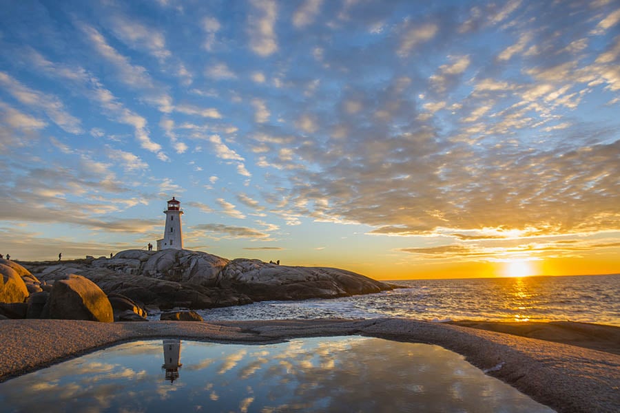 See sunset over the lighthouse at Peggy's Cove | Travel Nation
