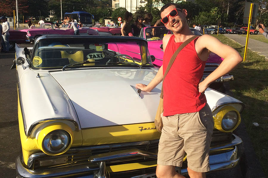 Graham with his classic yellow cadillac in Cuba | Travel Nation