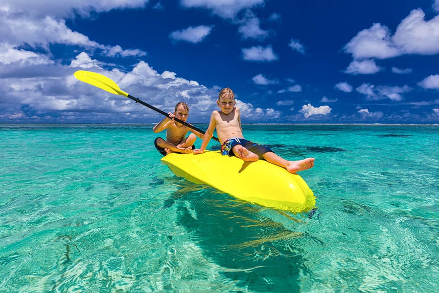 Watch the kids kayaking on clear blue waters | Travel Nation