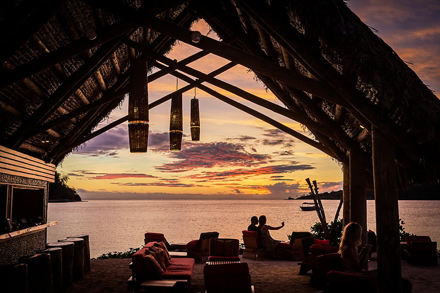 Watch the sunset from Likuliku's beachfront bar | Photo credit: Likuliku Island Resort
