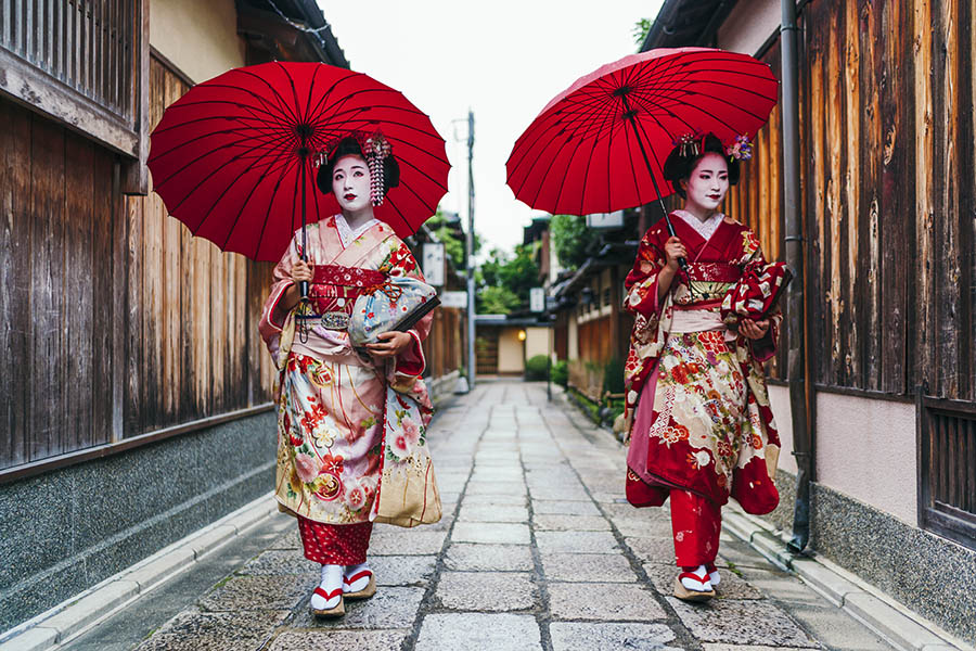 See colourful geisha walking around the Gion district