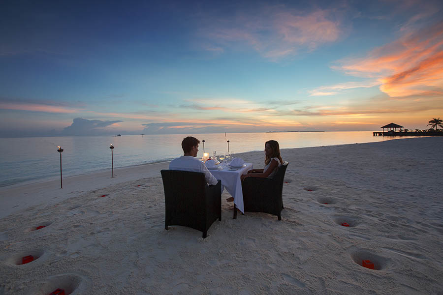 Enjoy a private candlelit dinner on the beach| photo credit: Velassuru Maldives