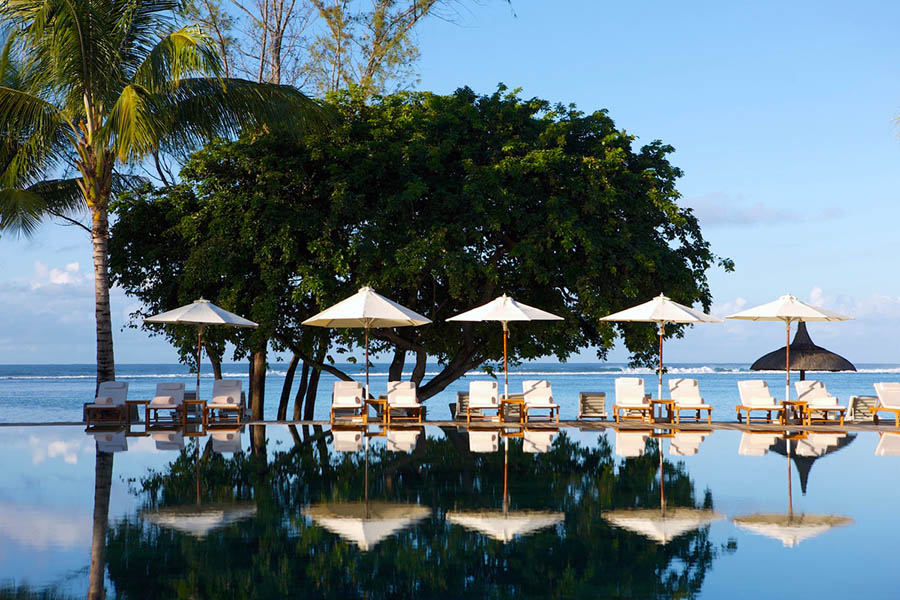 Relax around the pool at Outrigger Resort, Mauritius | Travel Nation