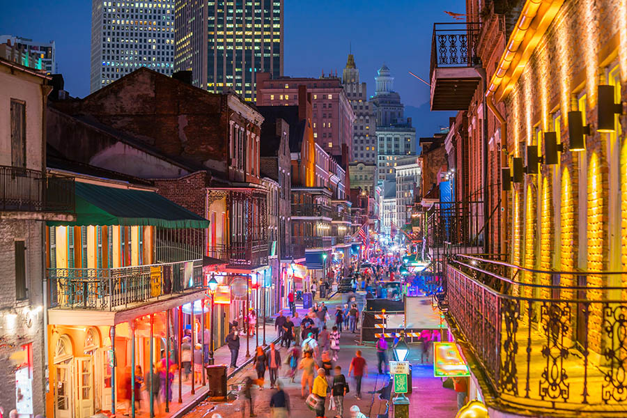 Bourbon Street is loud and bright at night Bourbon Street is loud and bright at night