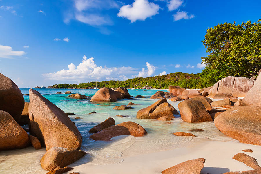 Scattered boulders on Anse Lazio in the Seychelles | Travel Nation