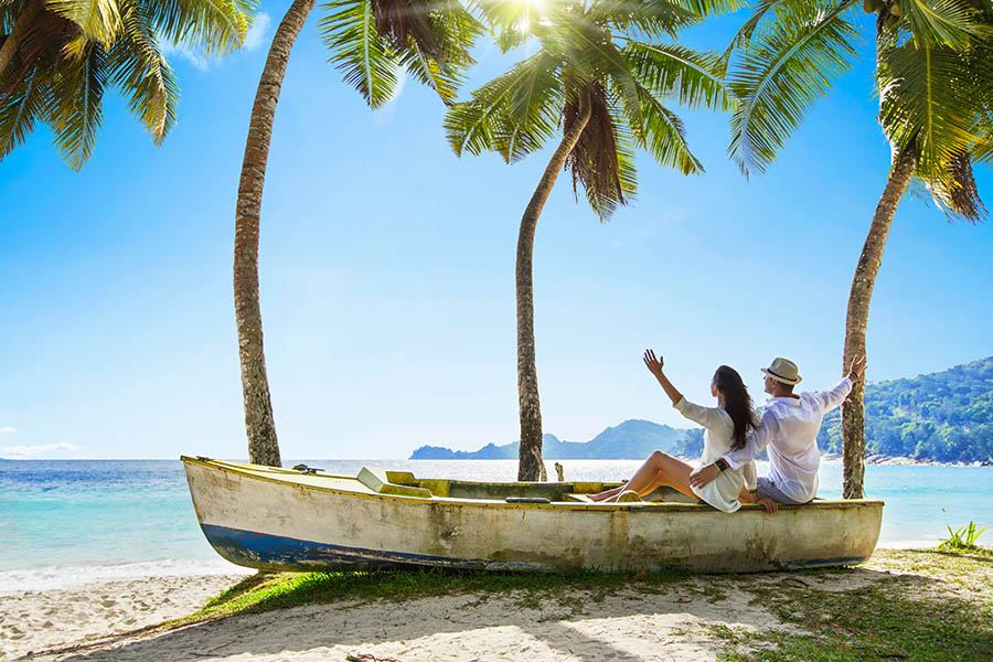 A couple on the beach in the Seychelles | Travel Nation