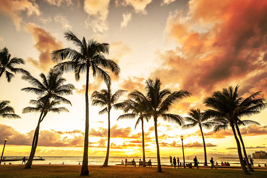 Stroll along Waikiki Beach at golden hour to see the sunset | Travel Nation