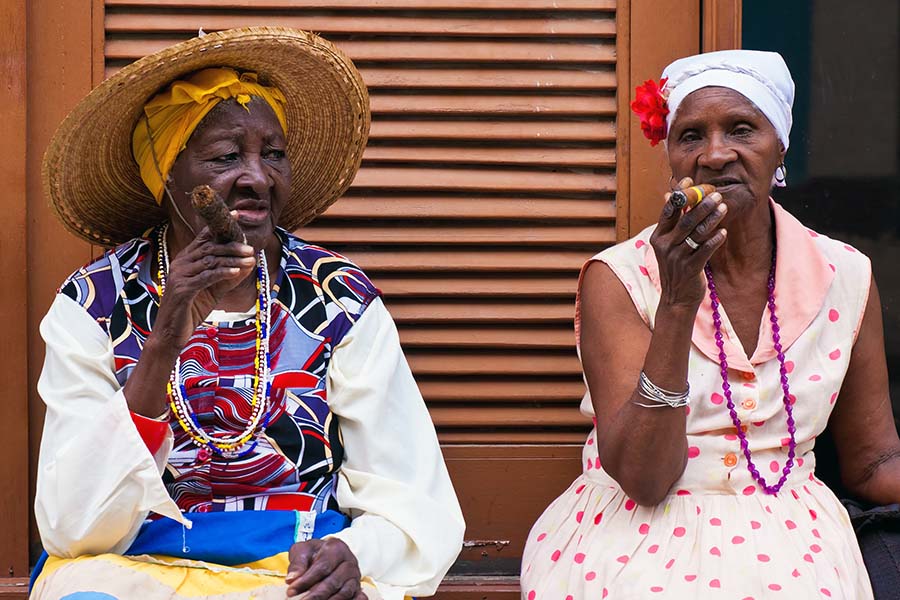 Two Cuban women smoking cigars