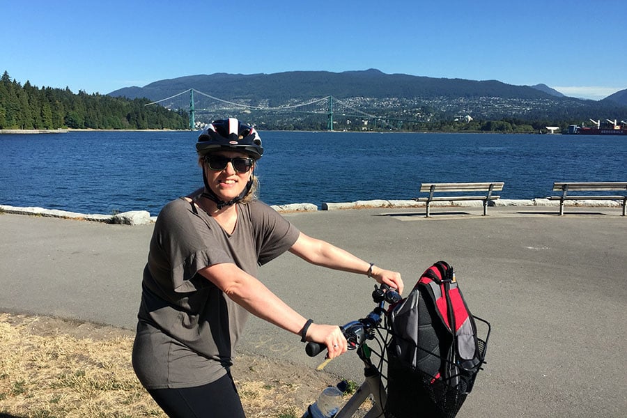 Helen takes in the sights of Stanley Park by bike