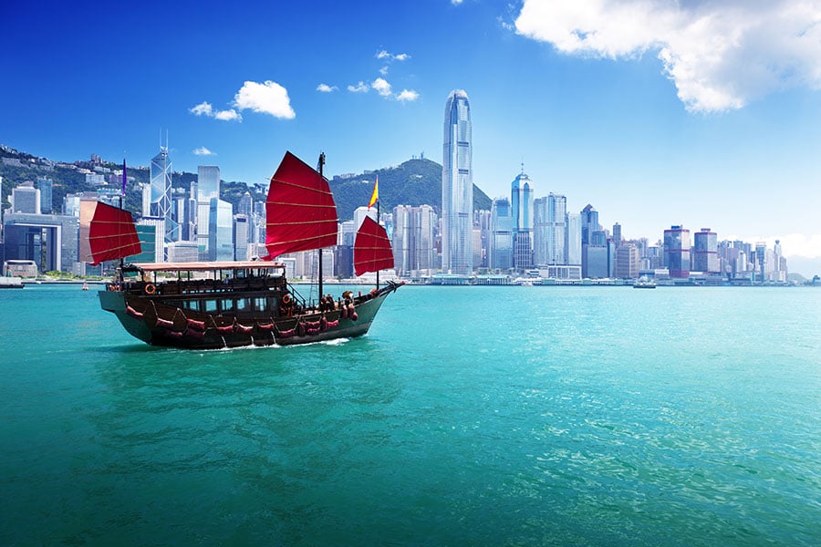 Relax on a junk boat as you cruise around Victoria Harbour