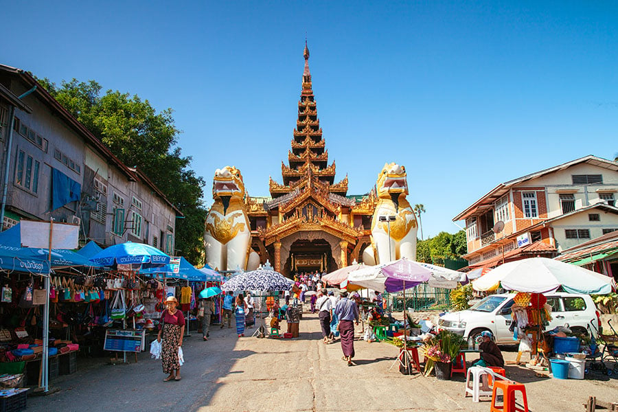 Wander through downtown Yangon where you’ll hop between tea shops and temples