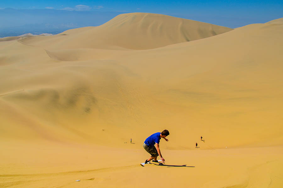 Try your hand at sand boarding in the dunes surrounding the oasis of Huacachina