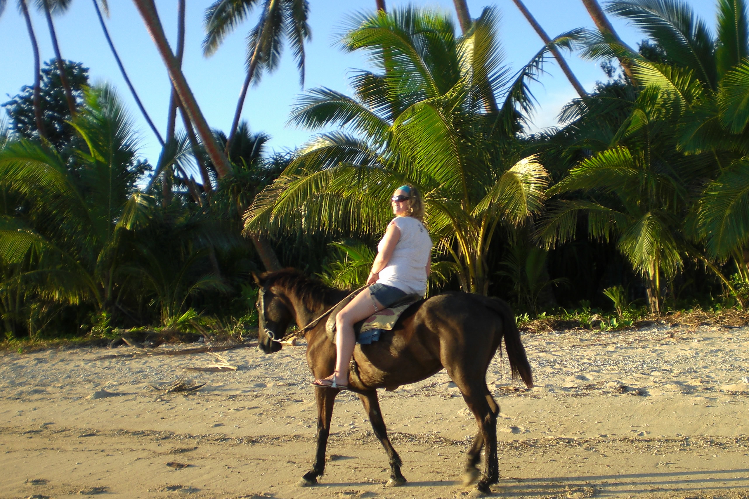 Sunset horseback ride along the beach in Fiji