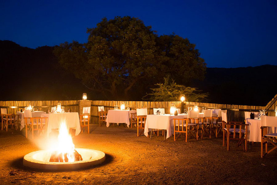 Enjoy delicious food by the fire | credit: Shepherd's Tree Lodge