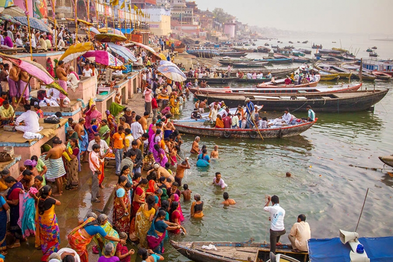 Varanasi is the spiritual home for Hindus and pilgrims come to bathe in the sacred waters by the Ghats