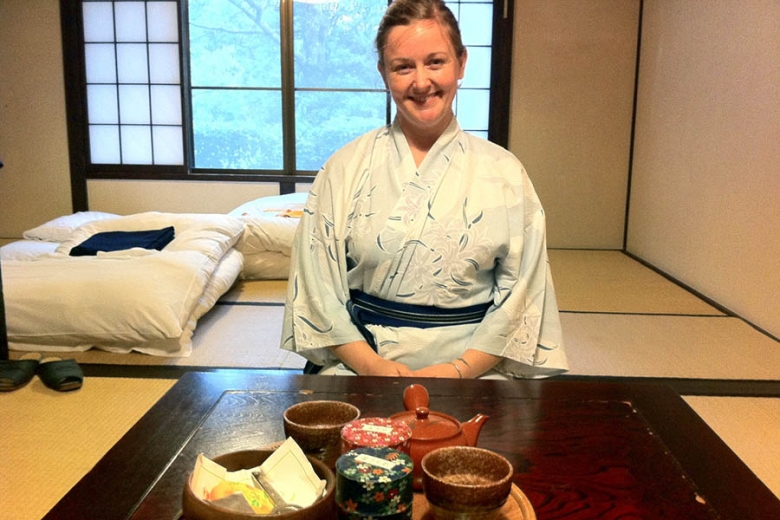 Woman enjoying tea at a Japanese ryokan