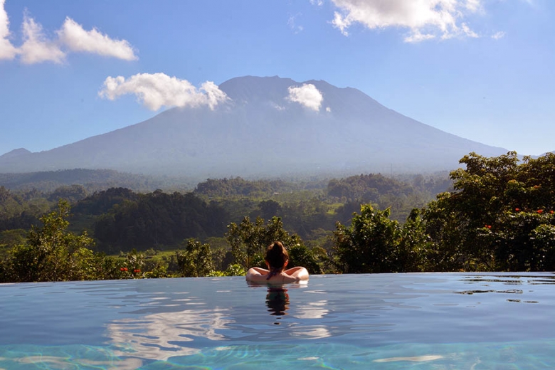 The infinity pool looks onto a spectacular view of Mount Agung