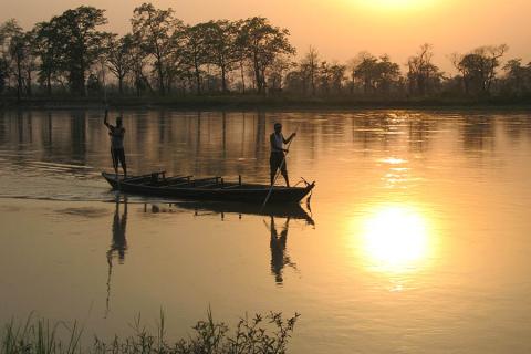 Boats at sunset in Chitwan National Park, Nepal | Travel Nation