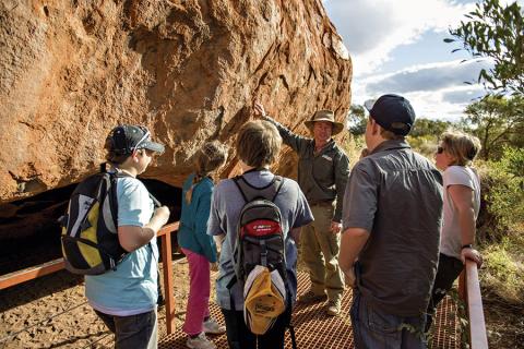 Enjoy a fascinating Uluru base walk with a local guide | Photo credit: Tourism NT