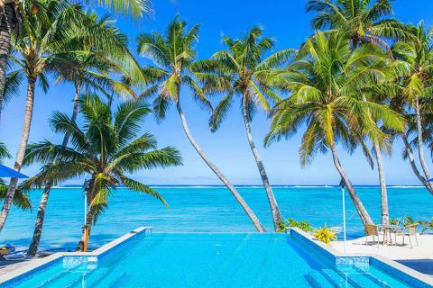 Infinity pool lagoon view at Little Polynesian Resort, Rarotonga | Travel Nation