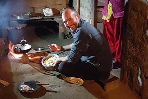 Jim cooking at his homestay in Nepal | Travel Nation
