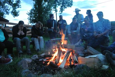 Campfire camarderie is all part of the fun on a group tour