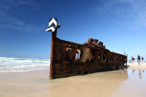 Whizz along 75 mile beach to discover the Maheno shipwreck