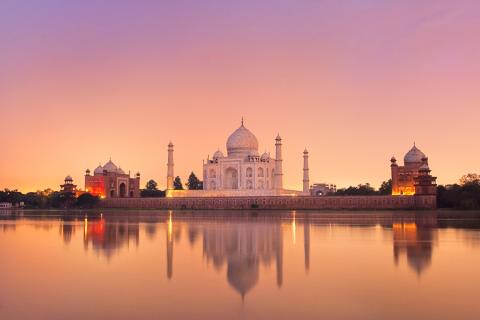 Soak up the orange and purple sunset at the Taj Mahal