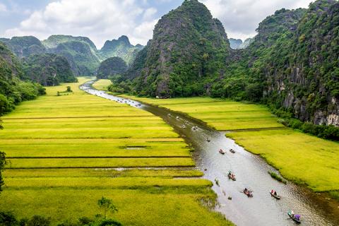 Take a leisurely boat trip through the limestone landscape of Ninh Binh