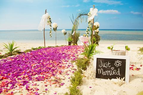 Flower pathway at a beach wedding, Thailand