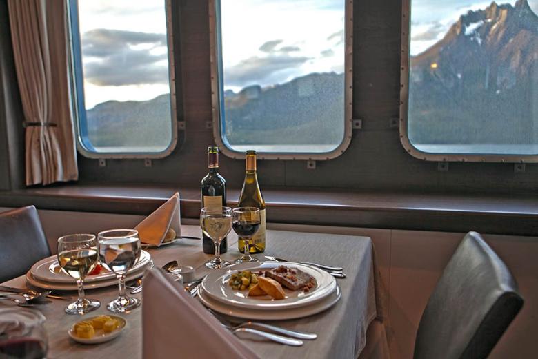 Dinner with a view on a luxury Australis Patagonia cruise | Credit: Australis Cruises