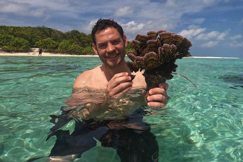 Chris learning about coral regeneration in the Maldives | Travel Nation