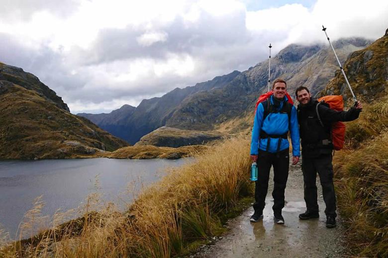 Chris getting a little wet as he walked the Routeburn Track | Travel Nation