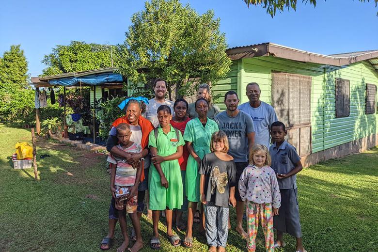 Chris and his family with the locals in Fiji | Travel Nation