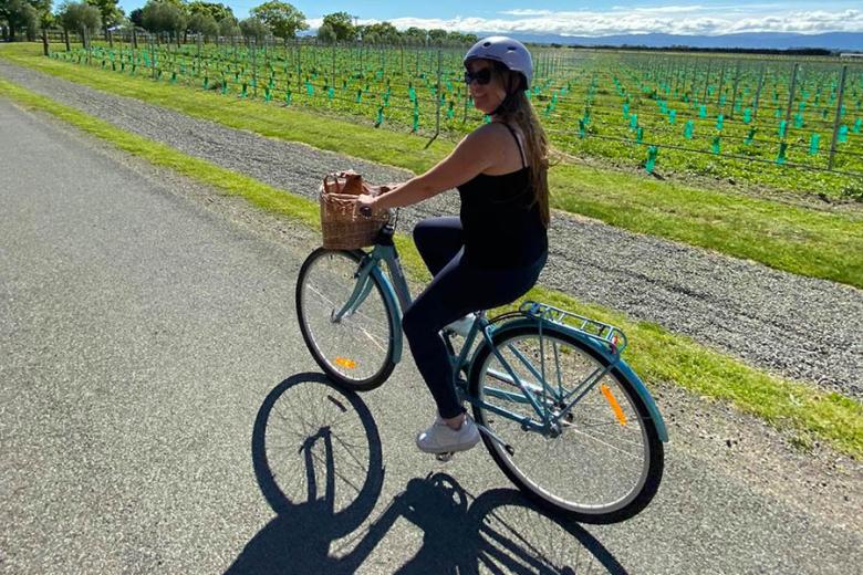 Amy cycling around the vineyards of Martinborough | Travel Nation