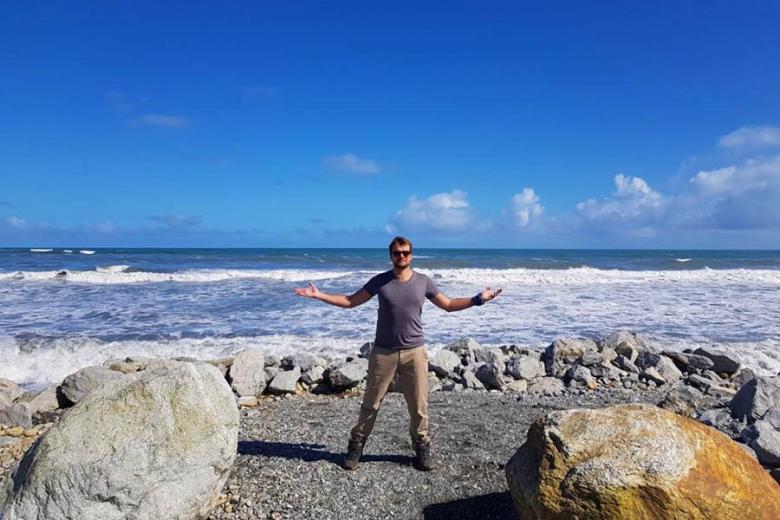 Adam living it up on Punakaiki Beach | Travel Nation