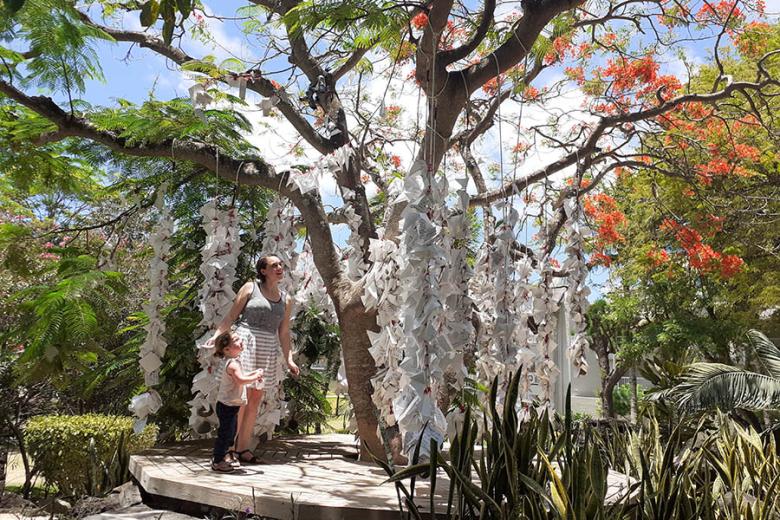 Claire and her daughter admiring the wish tree at the LUX* Grand Gaube | Travel Nation