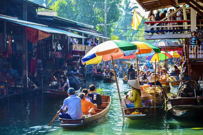 Visit the traditional floating markets of Bangkok