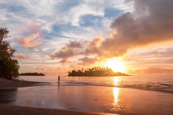 Watch sunrise over the calm waters of the Cook Islands | Travel Nation