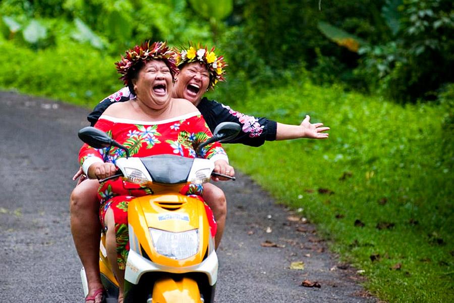 Two local women on a moped