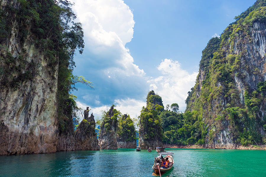 Visit Chieow Laan Dam by long tail boat and sail through the clear, emerald-coloured waters