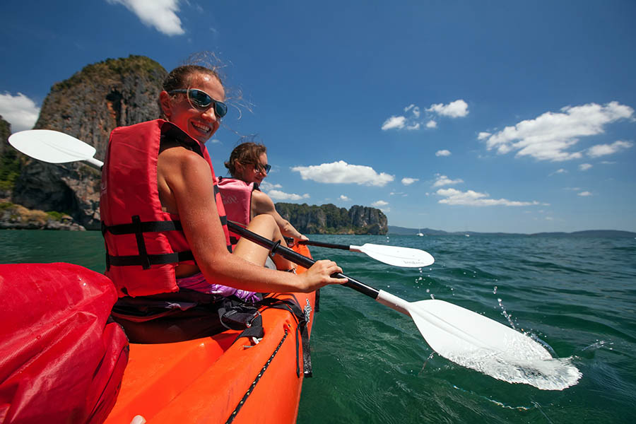 Two woman sea kayaking in Thailand