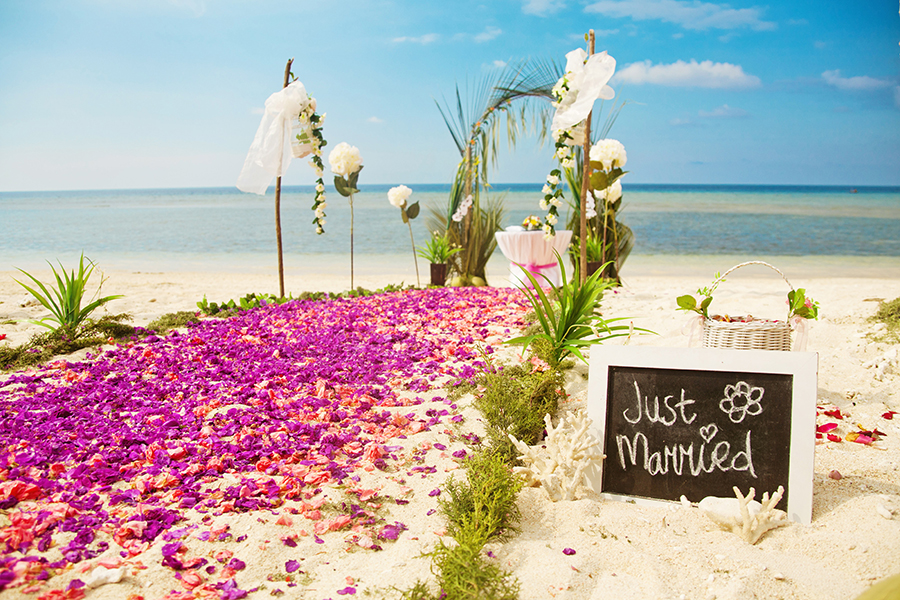 Flower pathway at a beach wedding